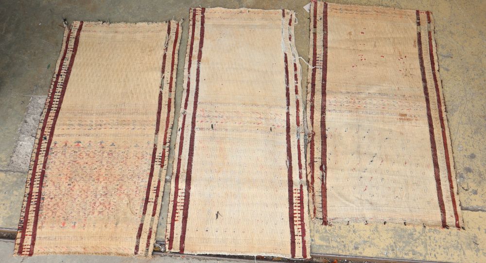 Three North West Persian mats, largest 96 x 54cm
